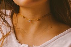 Dainty rainbow crystal teardrop choker necklace. Featuring clear teardrop with rainbow shimmer on cord. Fully adjustable with a sliding knot closure. CHOOSE YOUR COLOR CORD: ⌁ Mustard Yellow Cord ⌁ Sienna Brown Cord ⌁ Black Cord ✺ SIZE GUIDE ✺ ⌁ This choker is designed with a sliding knot closure and will comfortably adjust to a minimum of 13 inches to a maximum of 24 inches. ⌁ How to measure your neck size: If you don't have a seamstress tape measure, take a piece of yarn or string and wrap it Delicate Adjustable Everyday Choker, Adjustable Dainty Drop Necklace For Everyday, Dainty Adjustable Drop Necklace, Adjustable Minimalist Drop Necklace, Everyday Teardrop Casual Jewelry, Casual Teardrop Everyday Jewelry, Sliding Knot Closure, Dainty Necklaces, Indie Jewelry