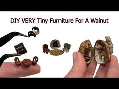 there is a hand holding some miniature furniture and accessories in it's left hand