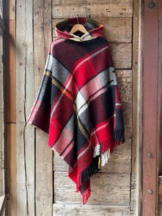 Black lambswool poncho cape hooded check Black/red ckecled hooded blanket poncho Long wool poncho cape in check Hooded poncho warm and light One size fits fashionably for most everyone, short or tall, big or small. This piece is versatile for both Men's & Women's outdoor fashion, and can be used insider in cooler winter weather to keep warm while reading on the couch. CARE: Hand-wash and hang to dry, light iron if needed, or dry clean. MEASURES: Length at the front of the neckline to the bottom Hooded Red Poncho For Fall, Red Hooded Poncho For Fall, Womens Outdoor Fashion, Long Poncho, Blanket Poncho, Plaid Poncho, Ladies Poncho, Wool Poncho, Hooded Poncho