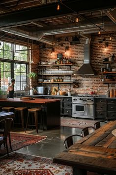 an industrial style kitchen with exposed brick walls and wooden tables, chairs, and appliances