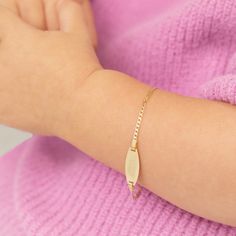 This beautiful children's bracelet is a beautiful way to celebrate your little girl or boys milestones. A stunning bracelet made from 14k yellow gold, that can be engraved to feature your little ones name. This will easily become your favorite gift, that you will be able to look back on and remember your little ones small wrist. Measuring at 5.5" this bracelet has enough room to fit as they grow. Gift box included with purchase. Kids Bracelet, Kids Bracelets, Id Bracelets, Yellow Gold Bracelet, Engraved Items, Toddler Kids, Bracelet Sizes, Milestones, Favorite Things Gift