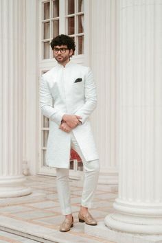 This sherwani is designed to fit seamlessly, ensuring a regal look tailored for grooms on their big day or anyone attending a grand celebration. The material is a high-grade silk blend that radiates a luxurious sheen and feels soft against the skin. The sherwani comes in various sizes to ensure a perfect fit for everyone. Available in a timeless white color, it pairs beautifully with a contrasting kurta or churidar. Top Details Color -white fabric -Designer Self-Design Print  Bottom Details Color -White Fabric - Cotton, Style -Pant Package Includes: Indo-western with pant  Turban, Mojari, And Other Accessories Are Not Sold Along With The Dress. **Important Note 1 CUSTOMIZATION - We can customize the products that are not printed. Contact us via messages if you have any queries. ----------- Mens Ethnic Wear Wedding, Sherwani For Men, Men's Ethnic Wear, Wedding Sherwani, Style Pant, Elegant Man, Wedding Suits Men, Indo Western, Churidar