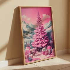 a pink christmas tree with presents in front of it on the floor next to a wall