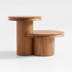 two wooden tables sitting next to each other