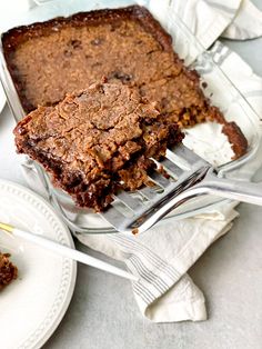 a fork is stuck into a piece of brownie