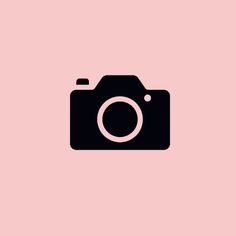 a camera on a pink background