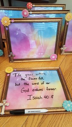 two framed pictures with flowers and a bible verse