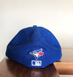 New Era Fifty Nine Fifty Toronto Blue Jays Fitted Hat size 7 1/2. This is a great looking hat that is different from the normal New Era's. It is unique, great color and awesome design. Blue Fitted Hat For Baseball Season Fan Gear, Blue Fitted Hat For Baseball Season, Blue Fitted Hat With Flat Brim For Baseball Season, Blue Flat Brim Fitted Hat For Baseball Season, Blue Flat Brim Fitted Hat For Fan Gear, Blue Baseball Cap With Flat Brim For Fan Gear, Blue Fitted Baseball Cap For Baseball Season, Blue Baseball Cap For Sports, Blue Snapback Fitted Hat For Baseball Season