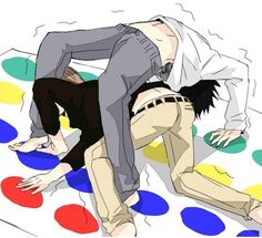 two people are laying on the floor with polka dot circles around them and one person is bending over