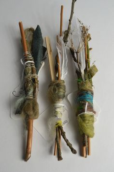 three different types of twigs are tied together and placed next to each other on a white surface