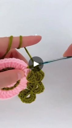 crochet video demonstrating how to knit the loop for an ornament in green and pink