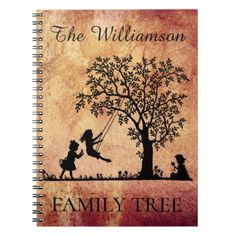 a spiral notebook with an image of two children swinging on a tree and the words,'the williams family tree '