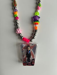 Bratz doll necklace This charm is a secondhand item and may show sign of use Birthday Soiree, Fandom Jewelry, Doll Necklace, Claw Necklace, Cute Car Accessories, Dope Jewelry, Bratz Doll, Funky Jewelry, Kinds Of Clothes