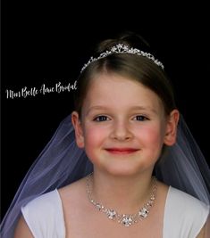 Fancy florid tiara with rhinestone flowers, marquise and encusted leaves. 1 inch tall. Tradition and style meet at Mon Belle Amie Bridal Boutique. Our iconic wedding veils and accessories are created to give you that long-lasting yet unique and elegant look. Our veils and accessories are a fabulous addition to your wedding look. A timeless choice for any bride, the Mon Belle Amie collection of modern and affordable veils and accessories feature shimmering embellishments that are designed to turn Tiara Simple, Communion Tiara, Tiara Flower, Flower Girl Tiara, Fingertip Wedding Veils, Crystal Headpiece Wedding, Wedding Accessories For Bride, Girls Tiara, Rose Gold Tiara