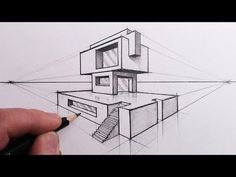 someone is drawing a house on paper with a pencil