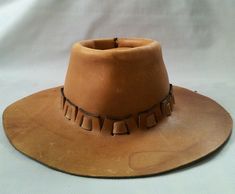 FOR SALE VINTAGE RARE AND HARD TO FIND BROTHER GAMBIT SLICK TRADING CO. EAST LANSING MICHIGAN LEATHER WESTERN COWBOY HAT SIZE M ( CHECK THE MEASURMENT ON THE BOTTOM. THE HAT IS IN VERY GOOD USED CONDITION HAS SOME SIGNS OF WEAR FROM BEING USED CHECK OUT THE PICTURES IT COMES AS SHOWN THANK YOU. The hat measures approx all in inches: Crown 4" Brim 3" Inside around 21" Vintage Leather Fedora For Rodeo, Vintage Leather Hat Band For Rodeo, Vintage Leather Fedora Hat Band, Artisan Brown Top Hat For Rodeo, Vintage Leather Hat For Western-themed Events, Rustic Leather Fedora For Rodeo, Rustic Leather Fedora For Western-themed Events, Custom Leather Hat Bands For Western-themed Events, Western Style Leather Hat For Festivals