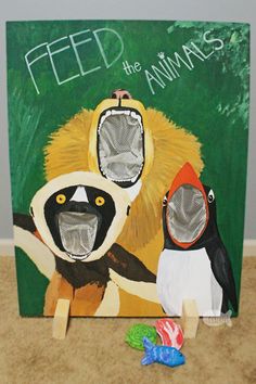 a painting of two animals with their mouths open in front of a sign that says feed the animals