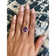 Amethyst, Pink Sapphire, and Diamond Cocktail Ring!  Playful yet Powerful! Its like having a piece of glittery candy on your finger! This ring has a Checkers Round Cut Amethyst that weighs 4.90 Carats and is embellished with alternating 12 Pink Sapphires that weigh 0.28 Carats and 12 Round Cut Diamonds that weigh 0.20 Carats. (Clarity: SI2, Color:F) The total carat weight of the ring is 5.38 Carats.  The ring is crafted in 14 Karat Yellow Gold and weighs approximately 4.8 grams. The ring is a si Yellow Gold Cocktail Ring, Diamond Cocktail Ring, Gold Cocktail Ring, Gold Cocktail, Diamond Cocktail Rings, Sapphire Diamond, Ring Size 7, Cocktail Ring, Round Cut Diamond