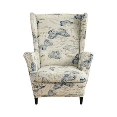 an upholstered wing chair with blue and white designs on the armrests