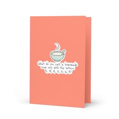 a pink card with an illustration of a tea cup on it