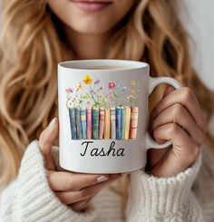 a woman is holding a coffee mug with books on it and the words tash