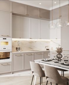 a kitchen with white cabinets and marble counter tops is shown in this image, there are four chairs around the table