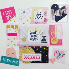 many different types of cards and stickers on a white surface with gold confetti