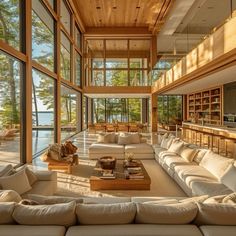 a large living room filled with furniture and lots of windows