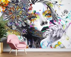 a wall mural with a woman's face and flowers