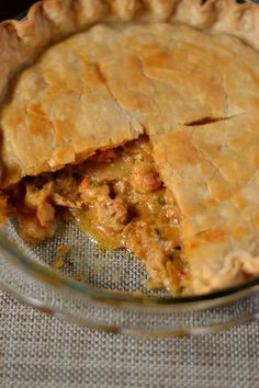 a pie that has been cut in half and is on top of a table cloth