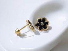 - 14K gold earrings featuring vibrant and glossy black enamel flower decor, perfect for adding a playful touch. - Kid-Friendly Screw Backs : Designed with secure screw backs for safe and comfortable wear, ideal for children. - Crafted from solid 14K gold, ensuring long-lasting beauty and strength. - A charming and age-appropriate accessory for kids or youth, great for everyday wear. - Ideal for birthdays, special occasions, or just to make your little one feel special. ------------------------ * Each item is carefully crafted and comes ready to gift in a jewelry box.   * We offer a 14-day return policy and most items ship within 1-2 business days, though this may vary during peak seasons.  * Feel free to message us with any questions--happy to help!   * Follow our shop for more exciting pr Black Floral Decor, Gold Flower Earrings, Flower Decor, Enamel Flower, Earrings Black, Gold Flower, Everyday Jewelry, Gold Flowers, Black Enamel