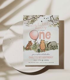 a birthday card with winnie the pooh and tigger on it, sitting next to a paper plate