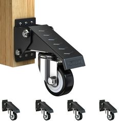 four different types of casteors are attached to a wooden block with black handles and wheels