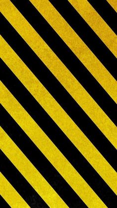 a black and yellow striped wallpaper that is diagonally opposite directions to each other