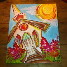 a painting of a windmill on a wooden floor