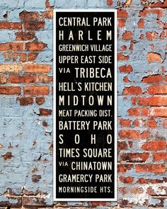 a sign on the side of a building that says central park harlem greenwich village upper east side via tribeca hell's kitchen midtown