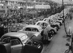 an assembly line with many cars in it