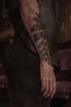 a man with a tattoo on his arm