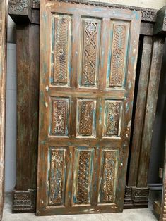 an old wooden door with decorative carvings on it