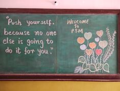 a chalkboard with flowers and words written on it