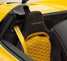 the interior of a yellow sports car