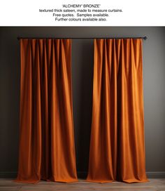 an orange curtain hanging on the side of a wall with text that reads, alchemy bronze textured satine made measure curtains