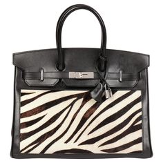 Hermès Black Box Calf Leather & Zebra Print Calfskin Pony Fur Birkin 35cm Retourne CONDITION NOTES The exterior is in very good condition with light signs of use and surface scratches throughout the leather. The pony fur calfskin has thinned on the back of the bag. The interior is in excellent condition with light signs of use. The hardware is in excellent condition with minimal signs of use. The turnlock plate, turn lock, strap plates and strap keepers are sealed. The corners are in excellent c Togo Leather, Hermes Bags, Black Box, Black Hardware, Hermes Birkin, Zebra Print, Birkin Bag, Fashion Handbags, Hermes Bag Birkin