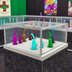 a display case filled with lots of different colored toothbrushes