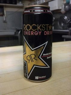 a can of rock star energy drink sitting on a counter