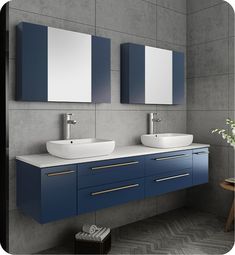 two sinks and mirrors in a bathroom with blue cabinets