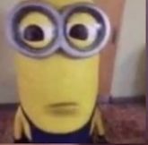 a close up of a minion with big eyes