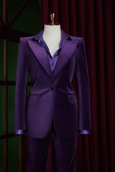 This premium purple, velvet suit is perfect for formal events and everyday wear. It features a customized design, a flattering flared trouser style, and a sleek, modern look with no belt loops. Make a statement and stand out with this versatile addition to your wardrobe. Elegant Purple Suit With Suit Collar, Velvet Notch Lapel Suit For Evening, Purple Tuxedo Style Formal Blazer, Fitted Purple Tuxedo Suit, Tailored Purple Tuxedo Blazer, Fitted Purple Suit With Collar, Fitted Purple Suit For Formal Occasions, Tailored Velvet Evening Suits, Fitted Purple Formal Suit