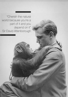 a man holding a baby oranguel in his arms with a quote on it