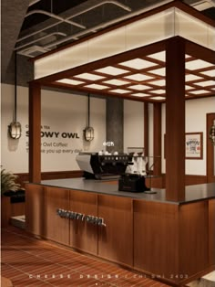 an open kitchen area with wooden cabinets and black counter tops, along with hanging lights